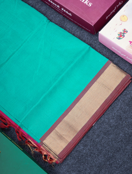 Saffire Green Plain Pure Silk Cotton Saree With Gold Zari Border