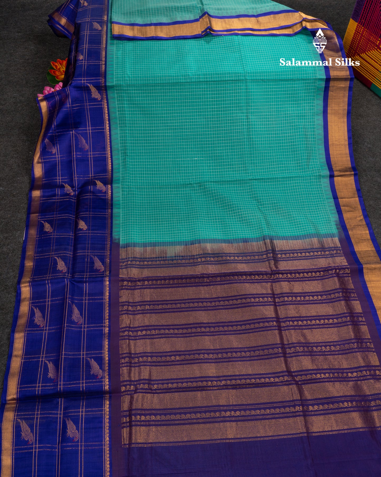 Sapphire Green Small Checks Pure Silk Cotton Saree With Contrast Long Violet Border & Parrot Motifs