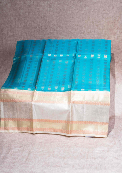 Pure Silk Pattu Pavadai (Dual Tone Peacock Green & Blue ) With Cream Sandal Blouse  44"