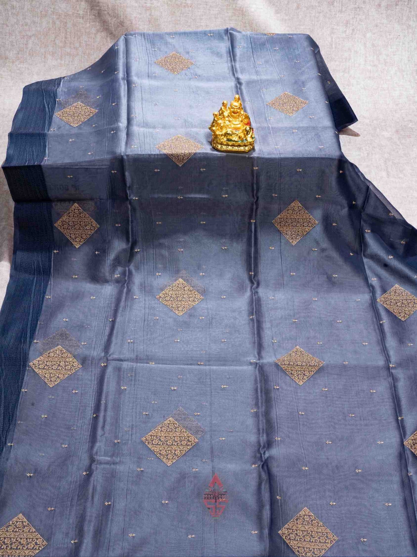 Grey color Organza Fancy Saree with Dark Blue Border