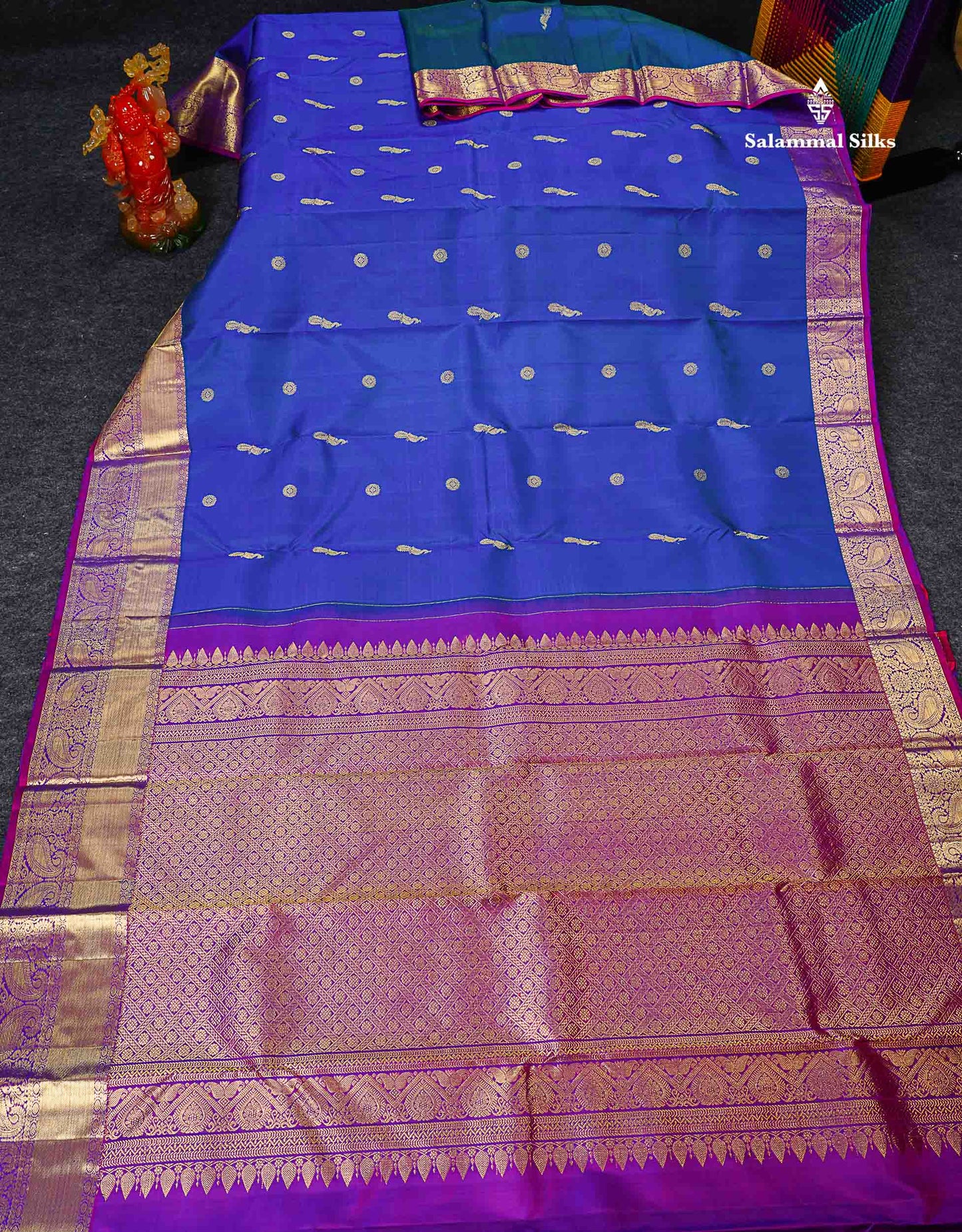 Pure Kanjivaram Silk Saree - Dual Tone Peacock Blue Chakaram & Peacock Butta Along With Contrast Dual Tone Purple Traditional Evening Morning Border