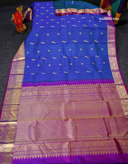 Pure Kanjivaram Silk Saree - Dual Tone Peacock Blue Chakaram & Peacock Butta Along With Contrast Dual Tone Purple Traditional Evening Morning Border