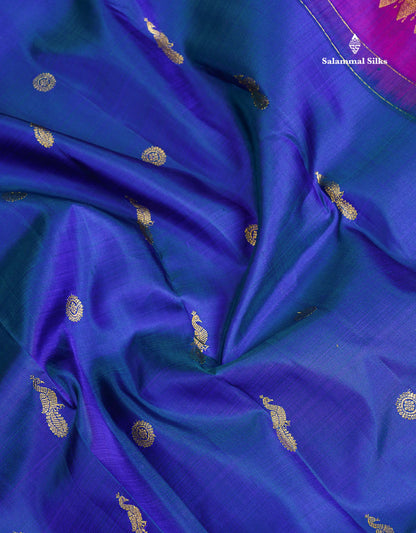 Pure Kanjivaram Silk Saree - Dual Tone Peacock Blue Chakaram & Peacock Butta Along With Contrast Dual Tone Purple Traditional Evening Morning Border