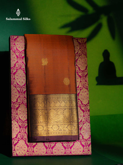 Beautiful Rust Orange Chakaram & Peacock Butta Pure Kanjivaram Silk Saree With Contrast Dark Brown Traditional Border