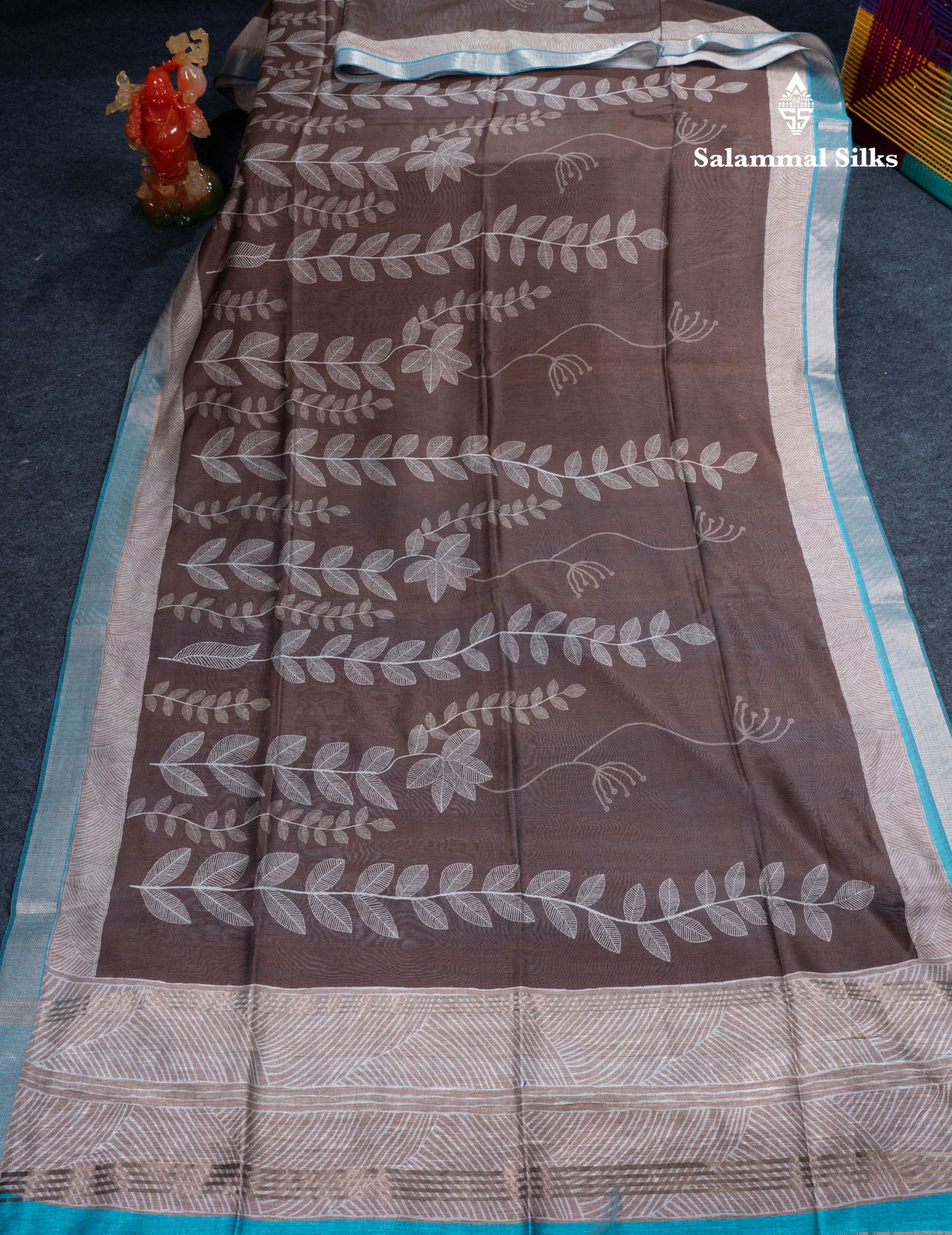 Brown Semi Crepe Silk Fancy Saree With Contrast Ramar Blue Small Border