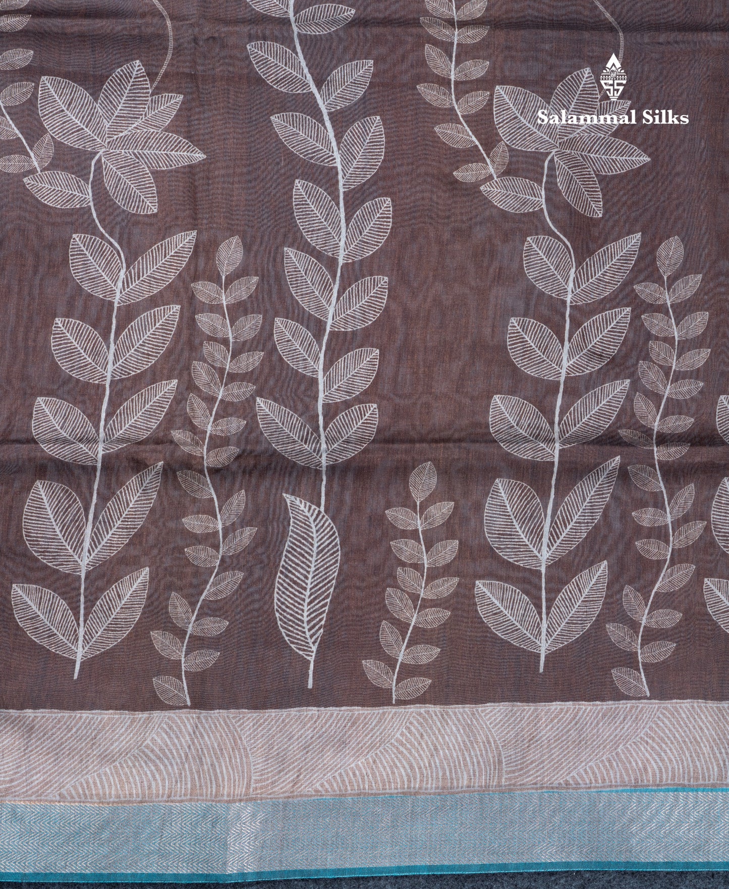 Brown Semi Crepe Silk Fancy Saree With Contrast Ramar Blue Small Border