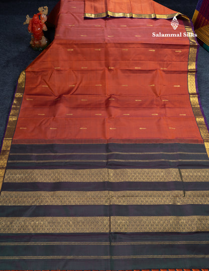 Rust Orange Pure Kanjivaram Silk Saree With Contrast Dark Bottle Green Blouse