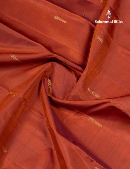 Rust Orange Pure Kanjivaram Silk Saree With Contrast Dark Bottle Green Blouse