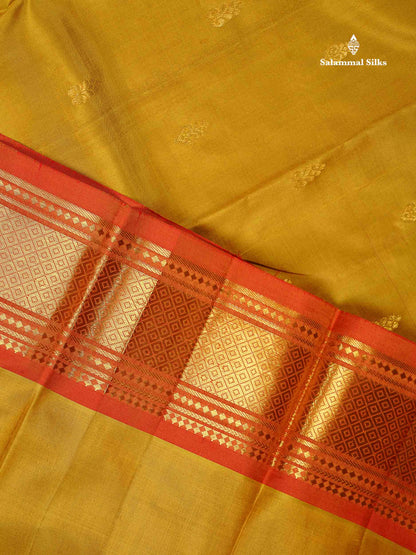 One Side Border Pure Silk Saree - Mehandi Green Colour Body Small Zari Butta With Contrast Rust Orange Traditional Border