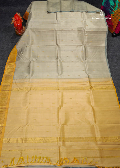 One Side Border Pure Silk Saree - Half White Colour Body Zari Butta With Turmeric Yellow Border