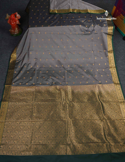 Semi Silk Saree -  Grey Colour Body Butta With Contrast Bottle Green Traditional Small Border