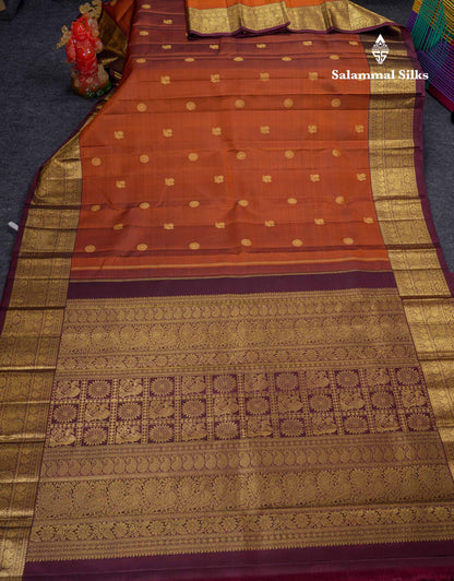 Beautiful Rust Orange Chakaram & Peacock Butta Pure Kanjivaram Silk Saree With Contrast Dark Brown Traditional Border