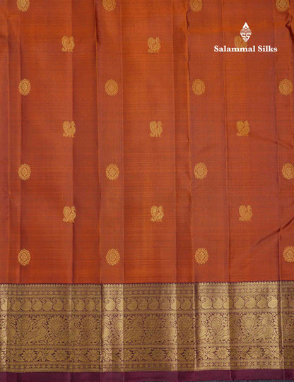 Beautiful Rust Orange Chakaram & Peacock Butta Pure Kanjivaram Silk Saree With Contrast Dark Brown Traditional Border