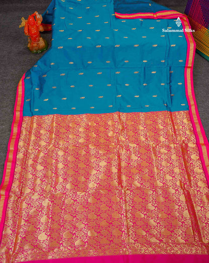 Semi Silk Saree - Peacock Blue Colour Body Zari Buttas With Contrast Pink Small Border | 10 Yards