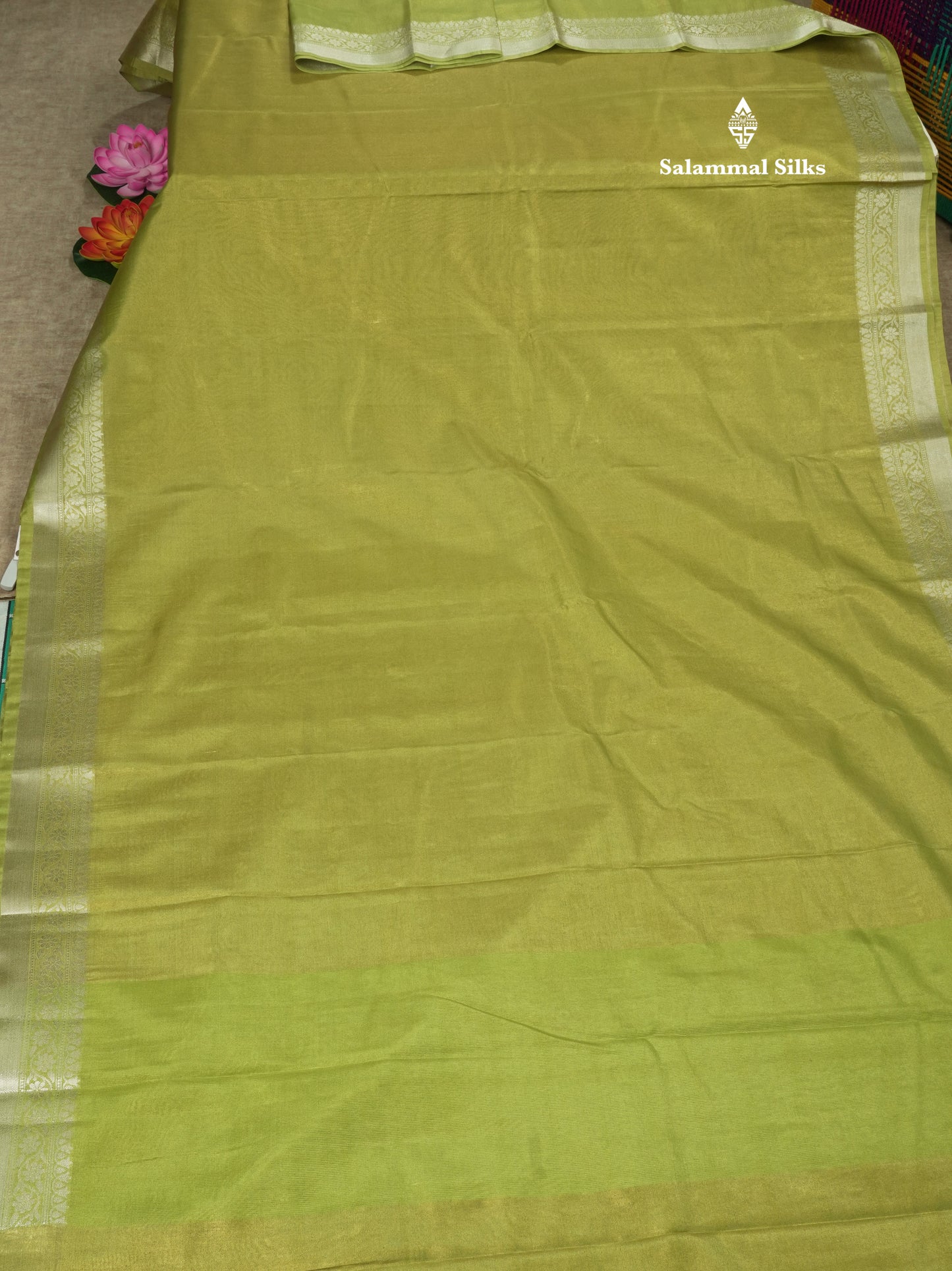 Parrot Green Plain Tissue Saree With Fancy Silver Border