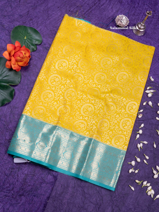 Semi Silk Pattu Pavadai  (Yellow) with Sapphire Green Colour Blouse 18"