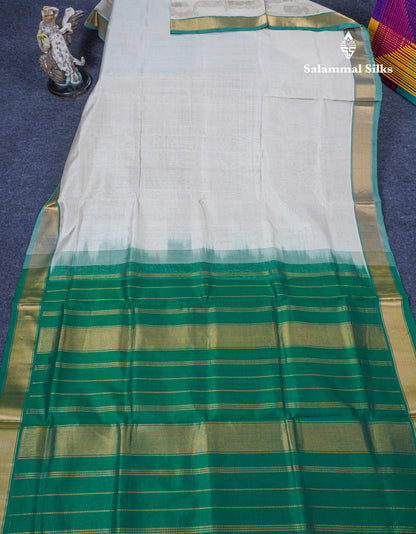 Half White Plain Pure Silk Cotton Saree With Contrast Bottle Green Blouse