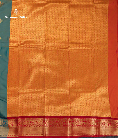 Beautiful Dual Tone Sapphire Green Zari Butta Semi Silk Saree With Contrast Orange Blouse