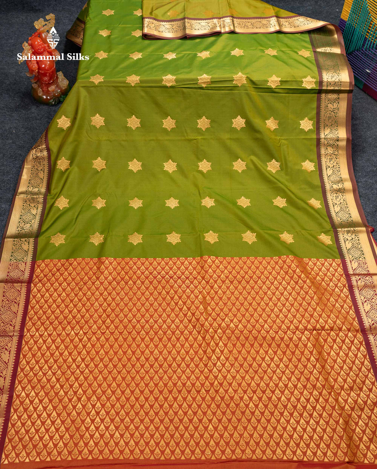 Beautiful Green Zari Butta Semi Silk Saree With Contrast Rust Orange Blouse