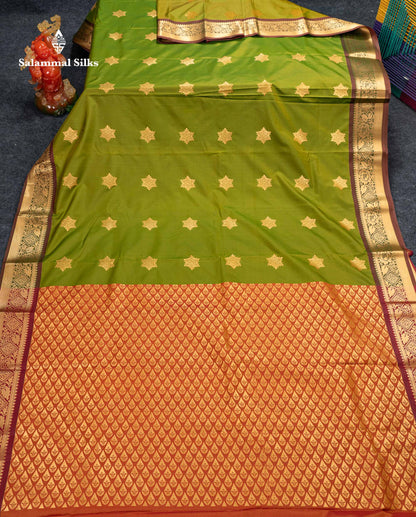 Beautiful Green Zari Butta Semi Silk Saree With Contrast Rust Orange Blouse