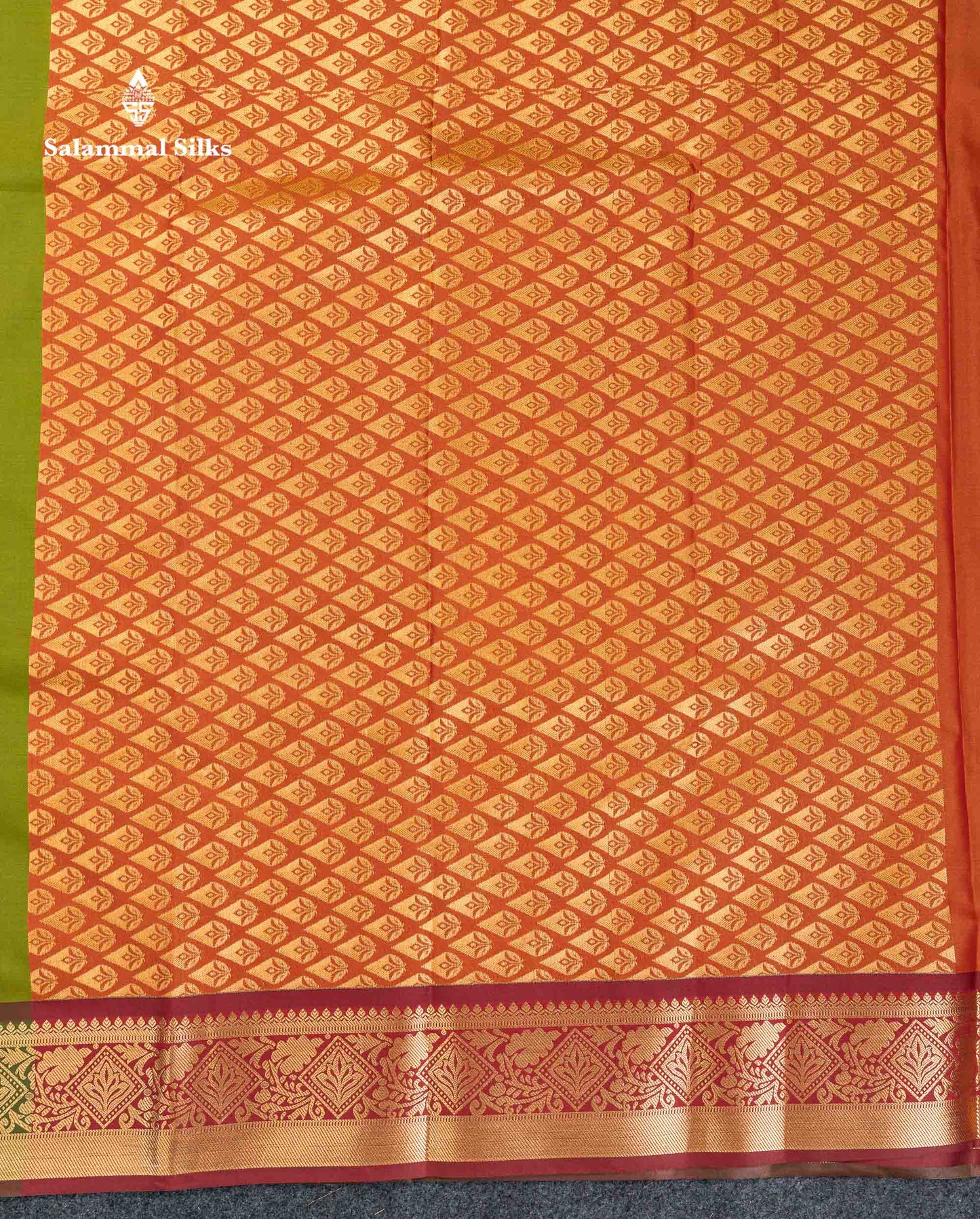 Beautiful Green Zari Butta Semi Silk Saree With Contrast Rust Orange Blouse