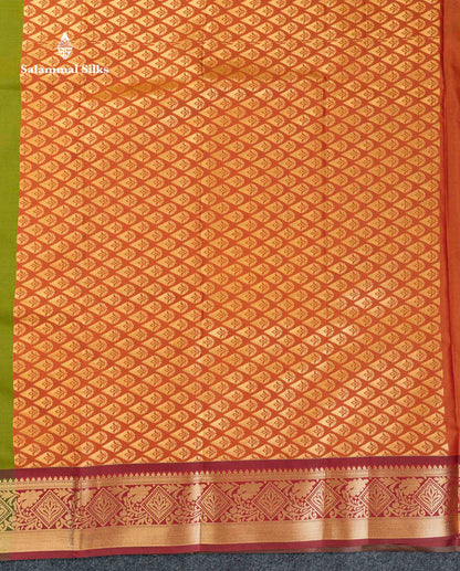 Beautiful Green Zari Butta Semi Silk Saree With Contrast Rust Orange Blouse