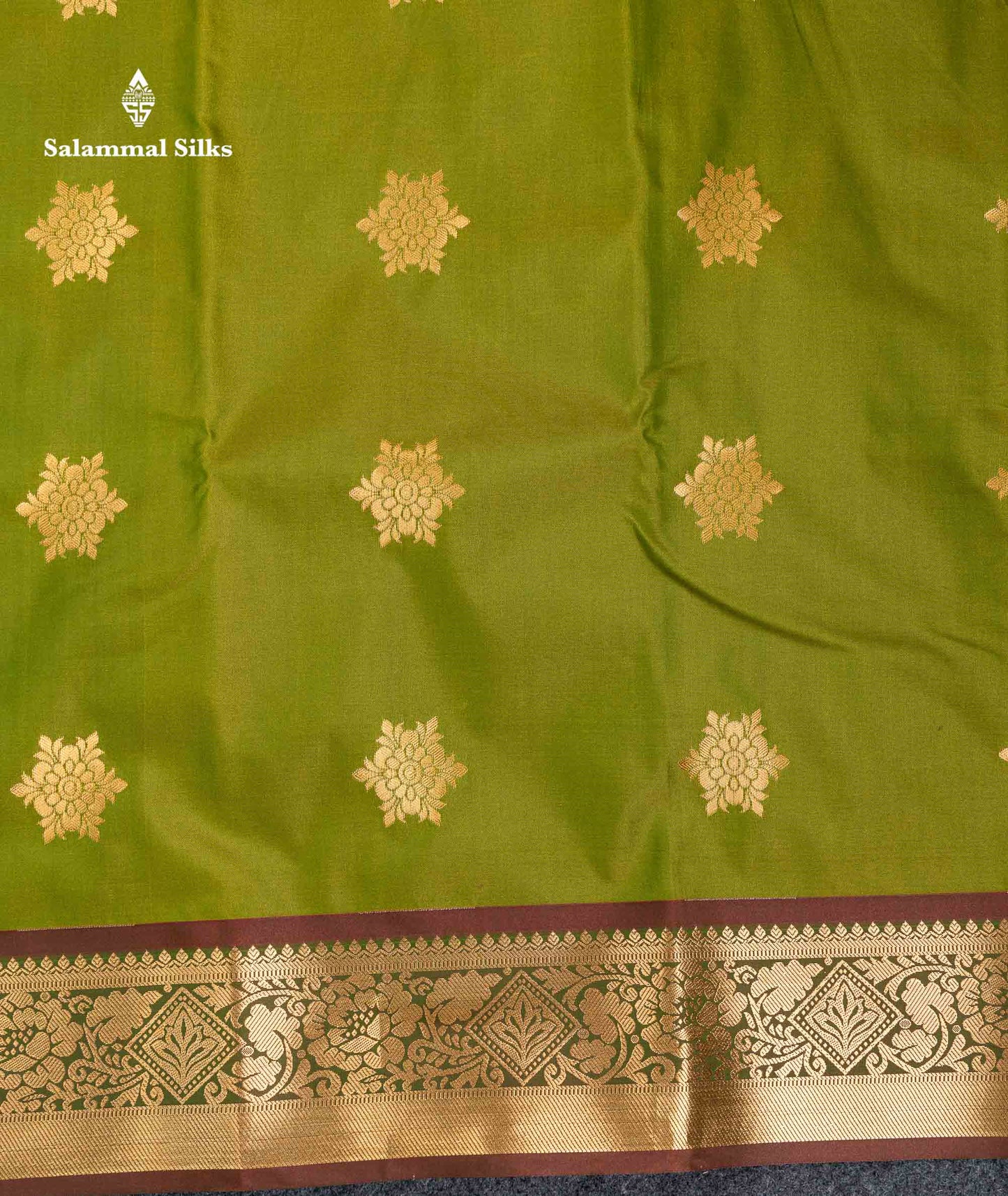 Beautiful Green Zari Butta Semi Silk Saree With Contrast Rust Orange Blouse