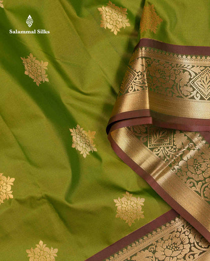Beautiful Green Zari Butta Semi Silk Saree With Contrast Rust Orange Blouse