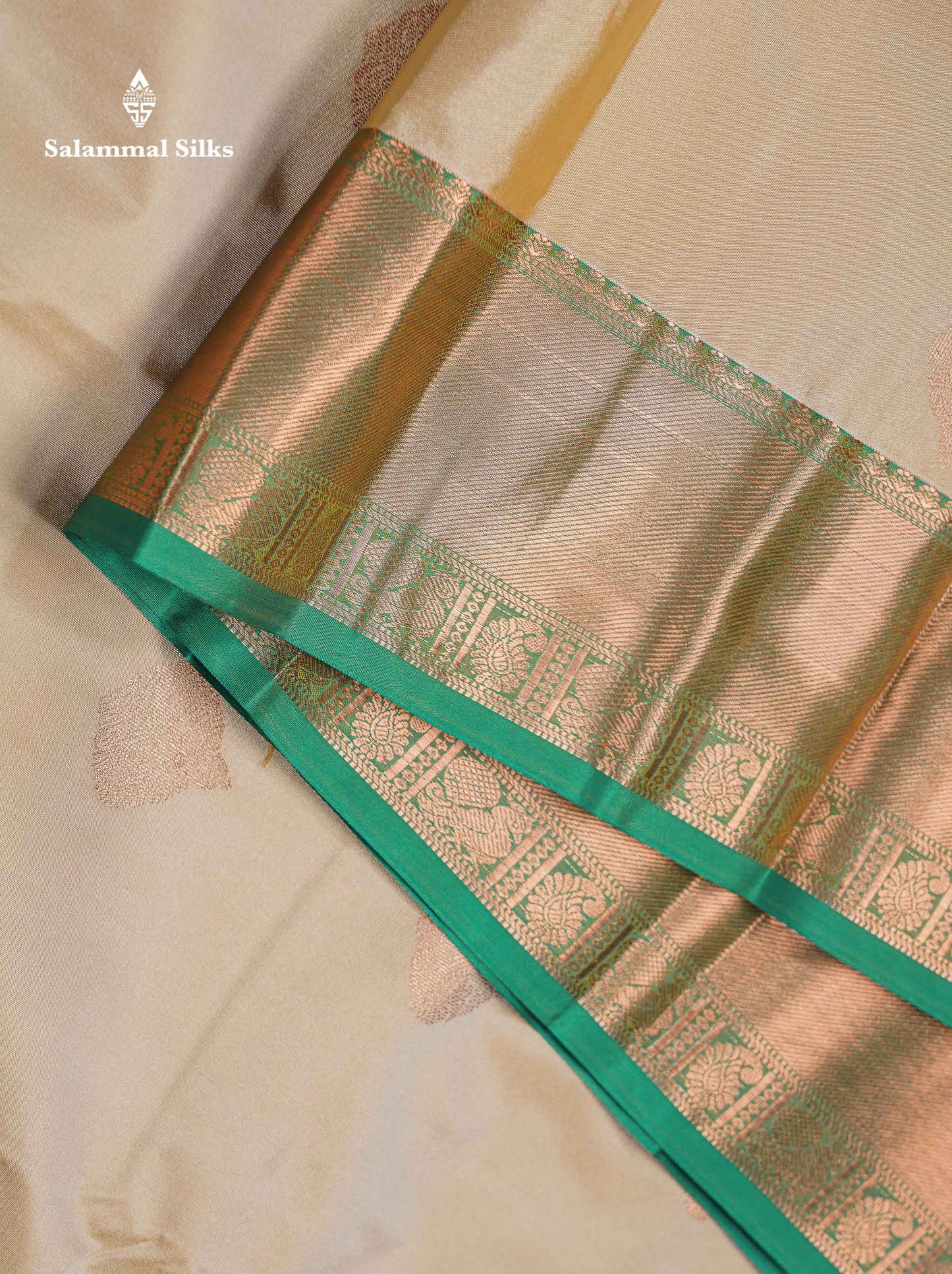 Beautiful Cream Sandal Zari Butta Semi Silk Saree With Contrast Sapphire Green Traditional Border
