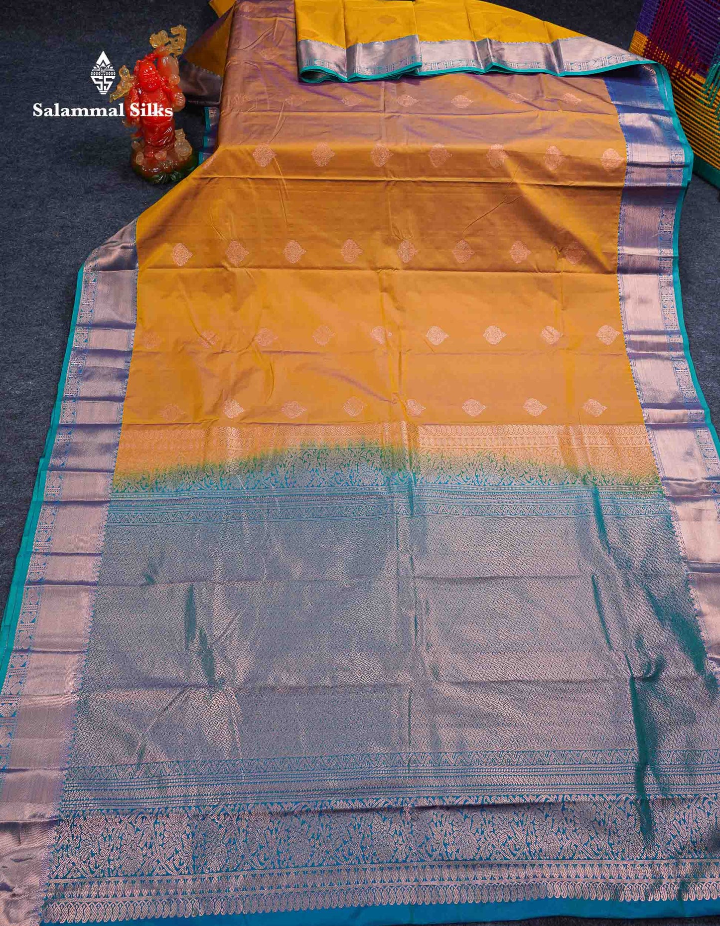 Beautiful Cream Sandal Zari Butta Semi Silk Saree With Contrast Sapphire Green Traditional Border
