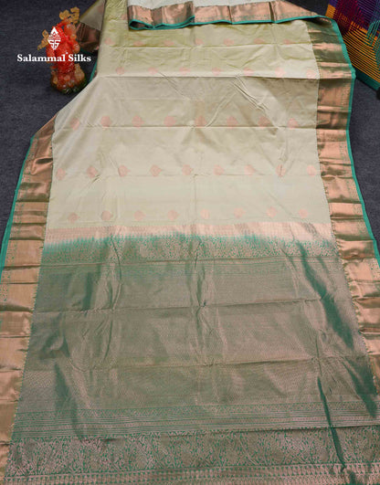 Beautiful Cream Sandal Zari Butta Semi Silk Saree With Contrast Sapphire Green Traditional Border