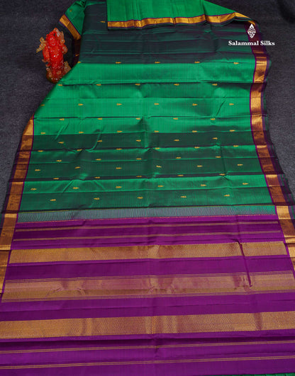 Pure Kanjivaram Silk Saree - Dual Tone Green Colour Body Small Butta With Contrast Traditional Small Border