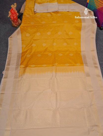 Beautiful Yellow Vaira Oosi With Butta Semi Silk Saree With Contrast Cream Sandal Traditional Rettapet Border