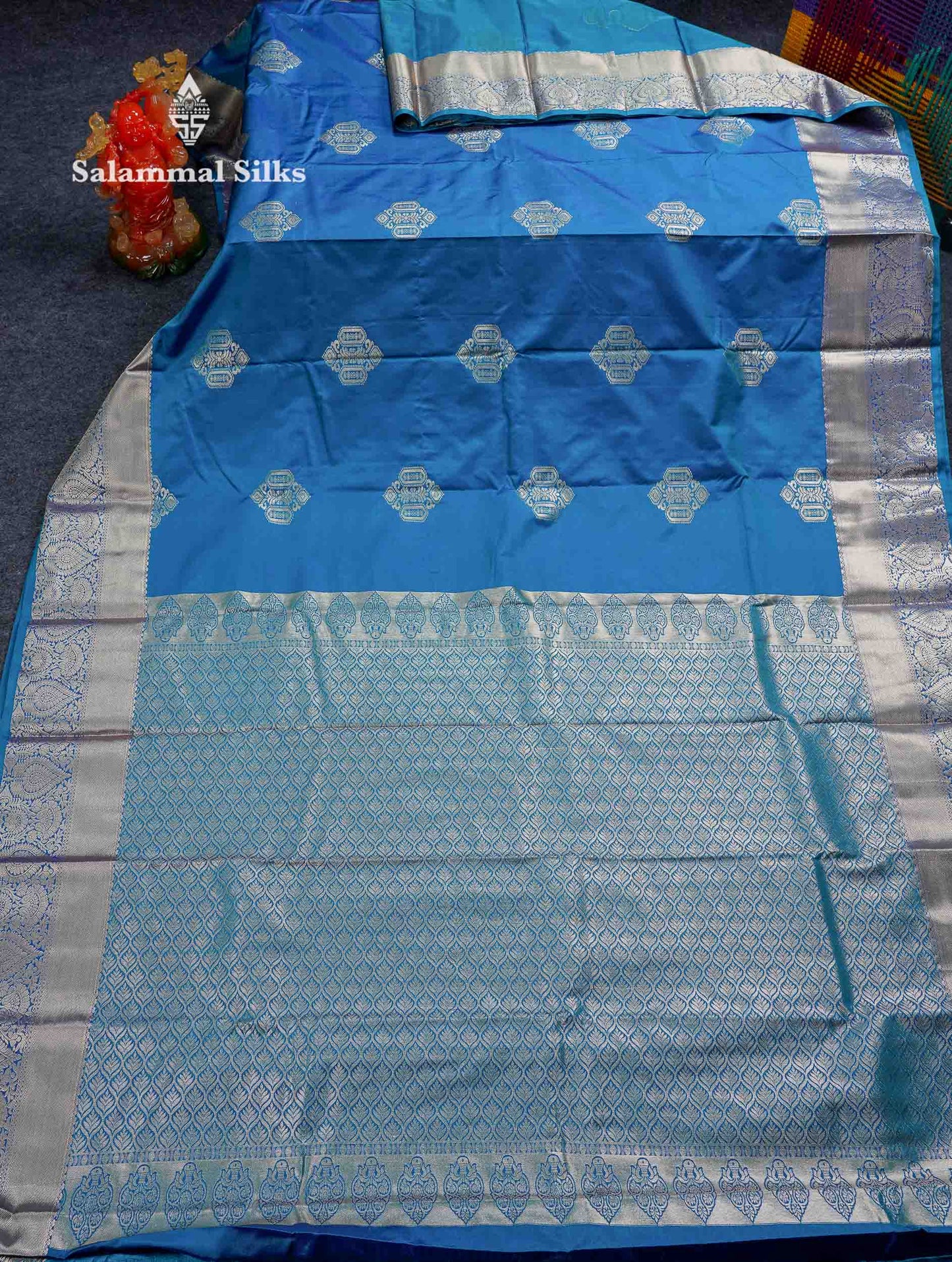 Beautiful Dual Tone Peacock Blue Zari Butta Semi Silk Saree With Traditional Border