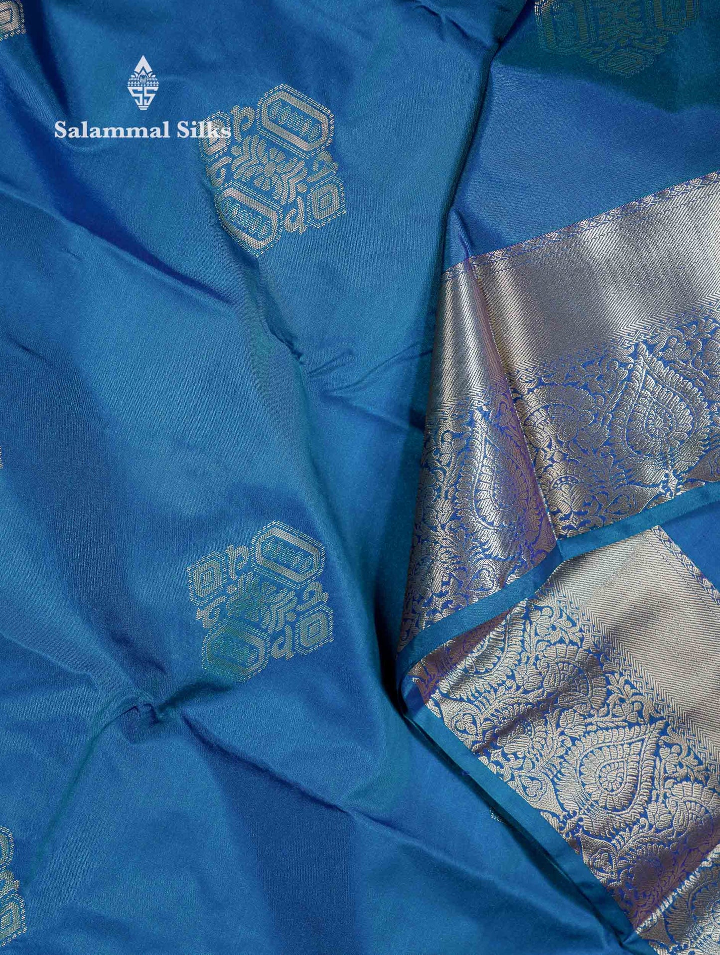 Beautiful Dual Tone Peacock Blue Zari Butta Semi Silk Saree With Traditional Border