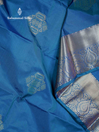 Beautiful Dual Tone Peacock Blue Zari Butta Semi Silk Saree With Traditional Border