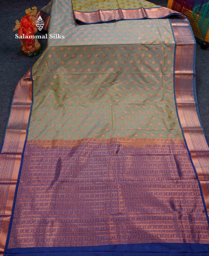 Beautiful Light Elaichi Green Zari Lines With Butta Semi Silk Saree With Contrast Dual Tone Blue Traditional Border