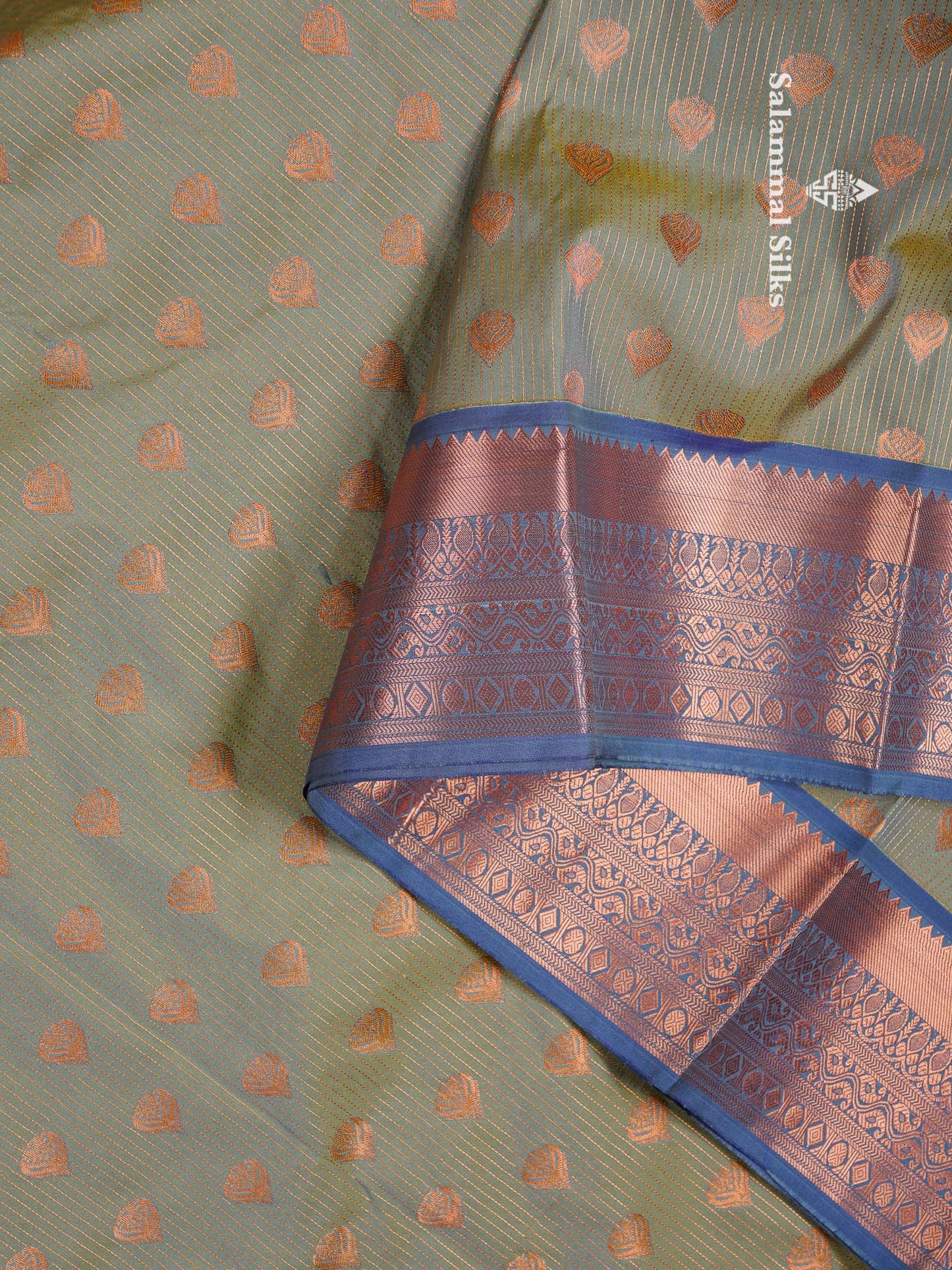 Beautiful Light Elaichi Green Zari Lines With Butta Semi Silk Saree With Contrast Dual Tone Blue Traditional Border