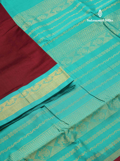 Beautiful Dark Maroon Plain 9 Yards Semi Silk Cotton Saree With Contrast Sapphire Green Traditional Border