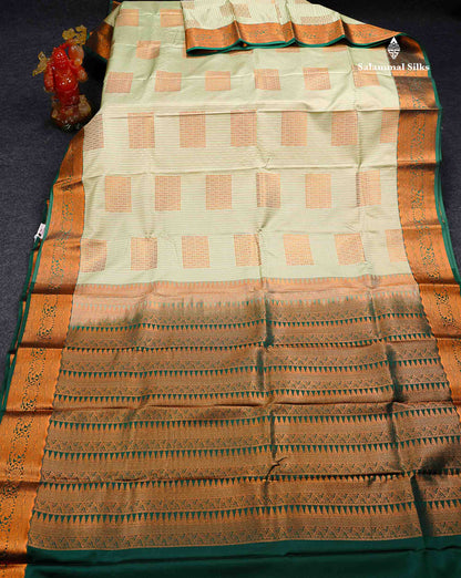 Beautiful Light Elaichi Green Zari Lines With Butta Semi Silk Saree With Contrast Bottle Green Traditional Border
