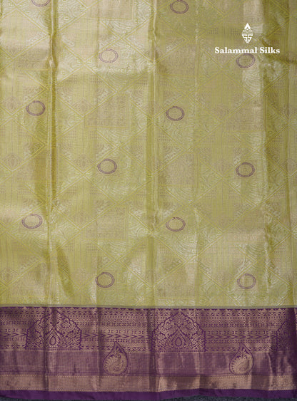 Lavender Geometric Pattern Tissue Bridal Semi Silk Saree With Contrast Peacock Green Traditional Border
