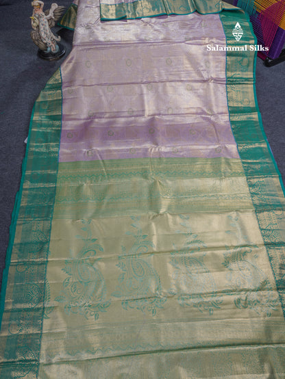 Lavender Geometric Pattern Tissue Bridal Semi Silk Saree With Contrast Peacock Green Traditional Border