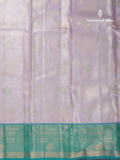 Lavender Geometric Pattern Tissue Bridal Semi Silk Saree With Contrast Peacock Green Traditional Border