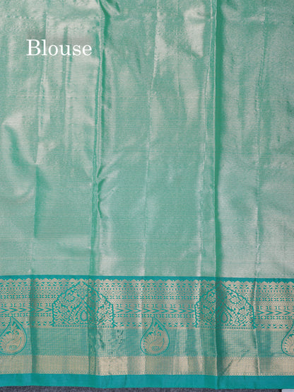 Lavender Geometric Pattern Tissue Bridal Semi Silk Saree With Contrast Peacock Green Traditional Border