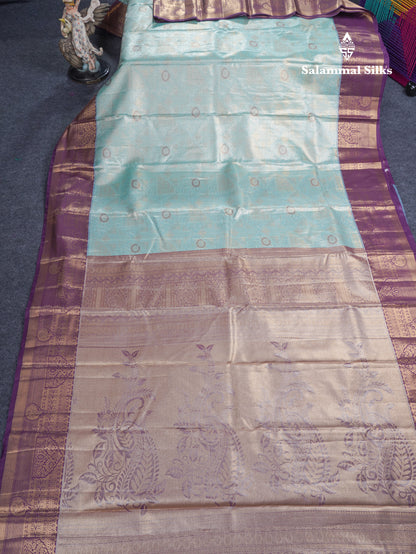 Lavender Geometric Pattern Tissue Bridal Semi Silk Saree With Contrast Peacock Green Traditional Border