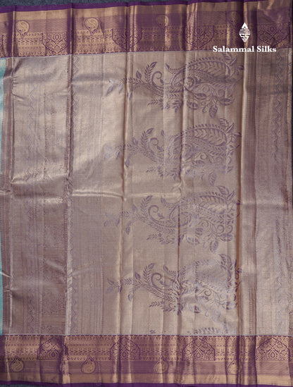 Lavender Geometric Pattern Tissue Bridal Semi Silk Saree With Contrast Peacock Green Traditional Border