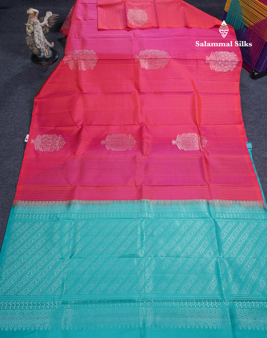 Dual Tone Pinkish Orange Pure Kanjivaram Silk Saree With Contrast Sapphire Green Blouse