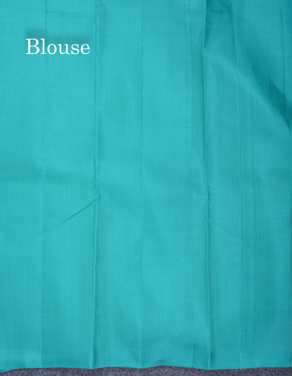 Dual Tone Pinkish Orange Pure Kanjivaram Silk Saree With Contrast Sapphire Green Blouse