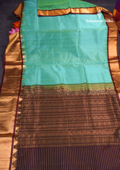 Pure Silk Cotton Dual Tone Sea Green Traditional Checks And Gold Silver Zari Lakshadeepam Buttas With Brown Border