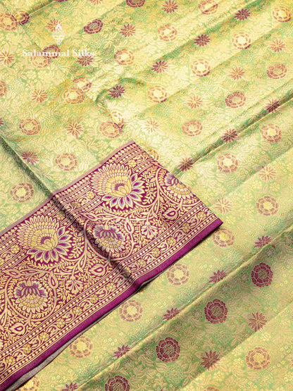 Beautiful Light Green Tissue Bridal Pure Kanjivaram Silk Saree With Contrast Dark Purple Menakari Work Border